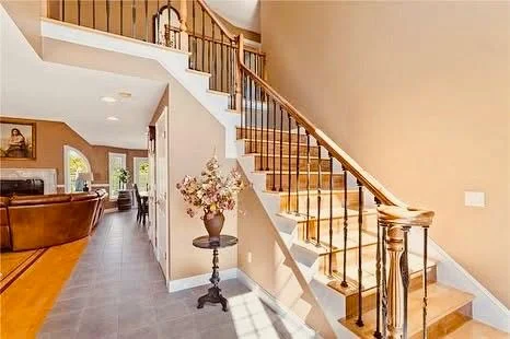 Interior staircase with wood railings