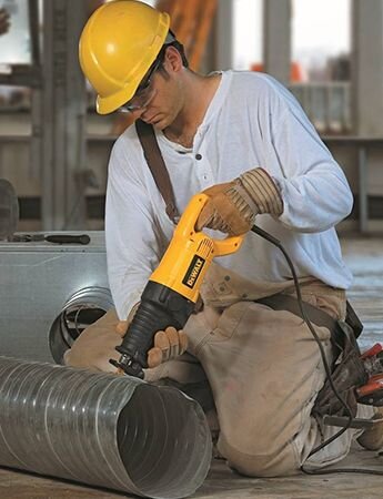 Worker using power tool