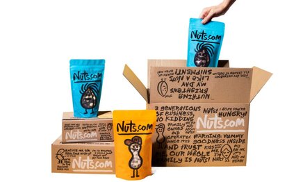 Customizable box: a big white box, with six colorful mini boxes filled with nuts.