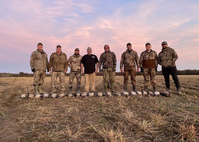 group of hunters with harvested specklebellies in Arkansas