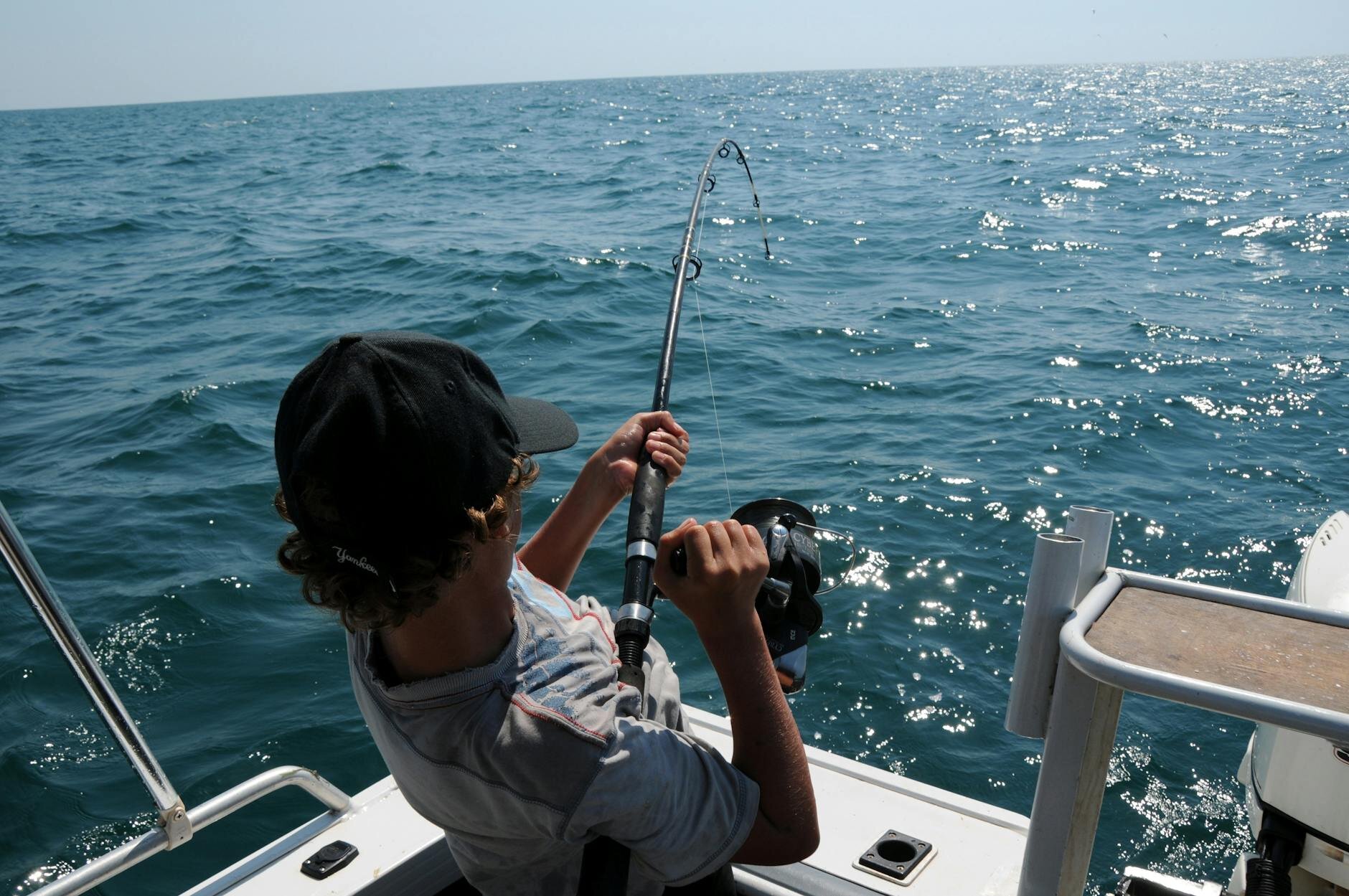 guy pulling his reel for a big catch