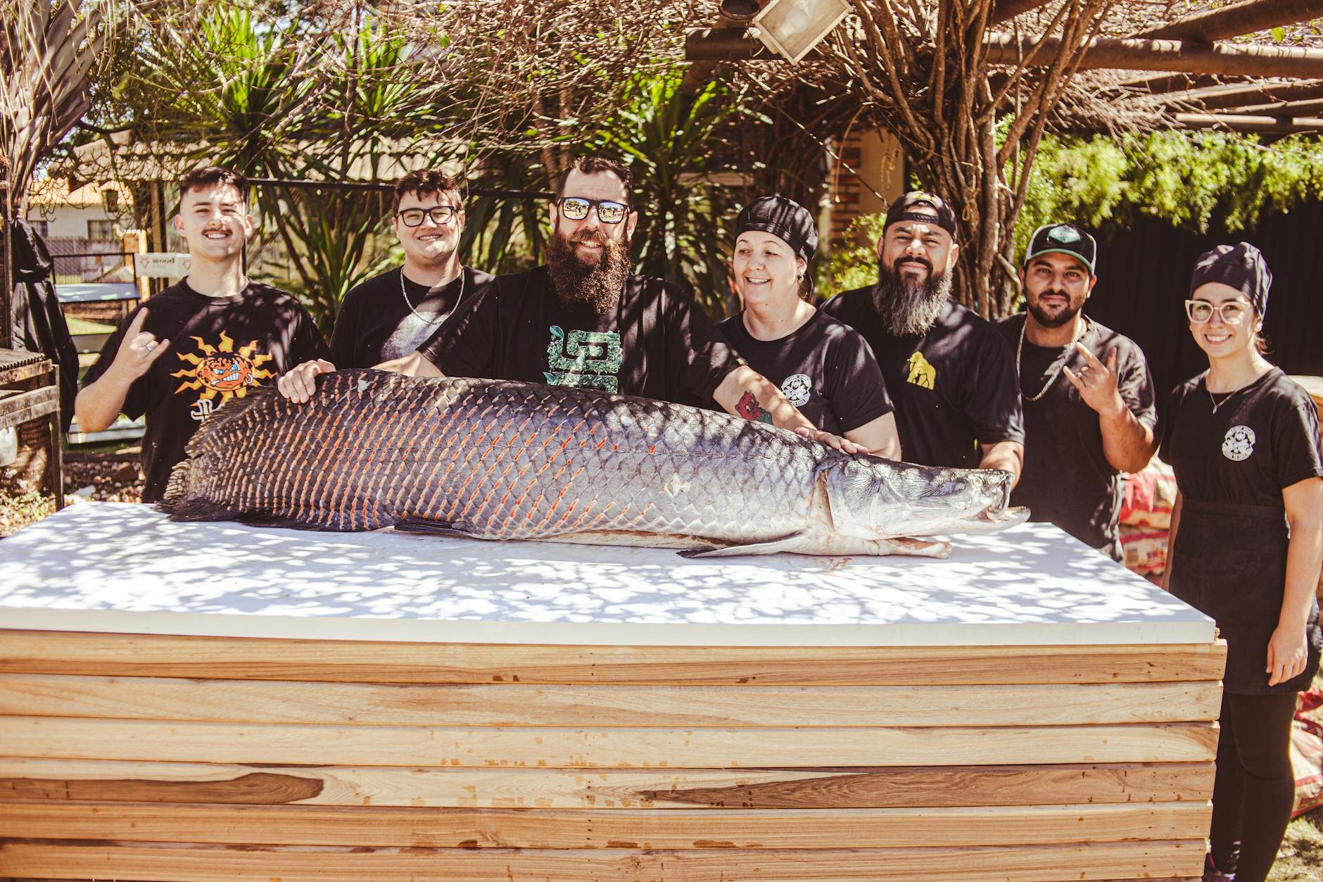 group of fishing friends posing with their big catch