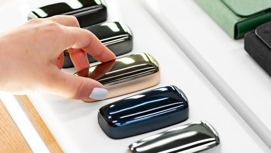 Display stand of Sobranie sticks for Ploom with heated tobacco technology logo in a shopping mall