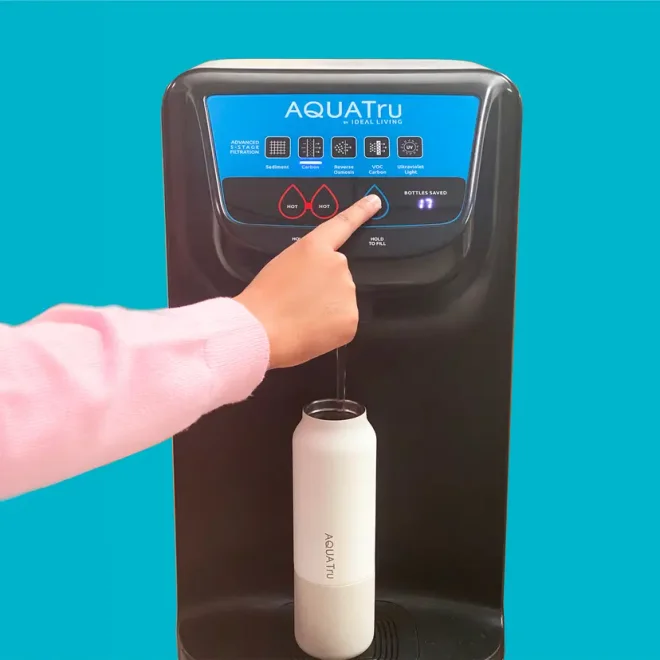 Lady enjoying water with Carafe unit