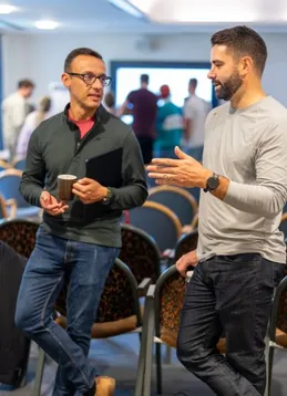 Two Push Security employees discussing ideas for the group activity happening