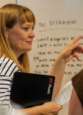 A Push employee engaged in a group exercise with members from other disciplines in the company