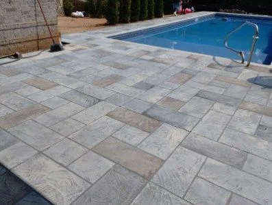 Gray and tan stamped concrete pool deck
