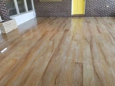 Wood-plank patterned concrete porch overlay