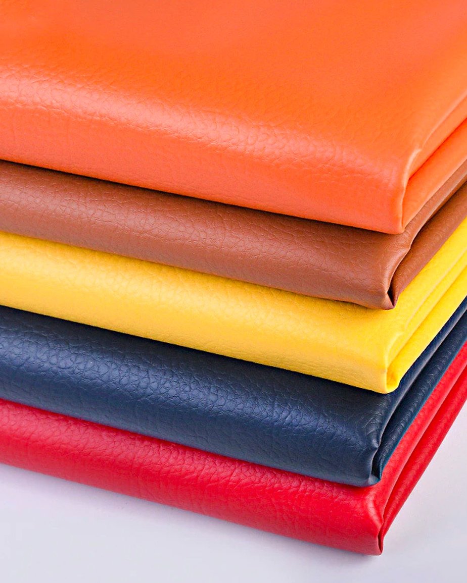 Multiple layers of brightly coloured PU leather stacked on top of one another