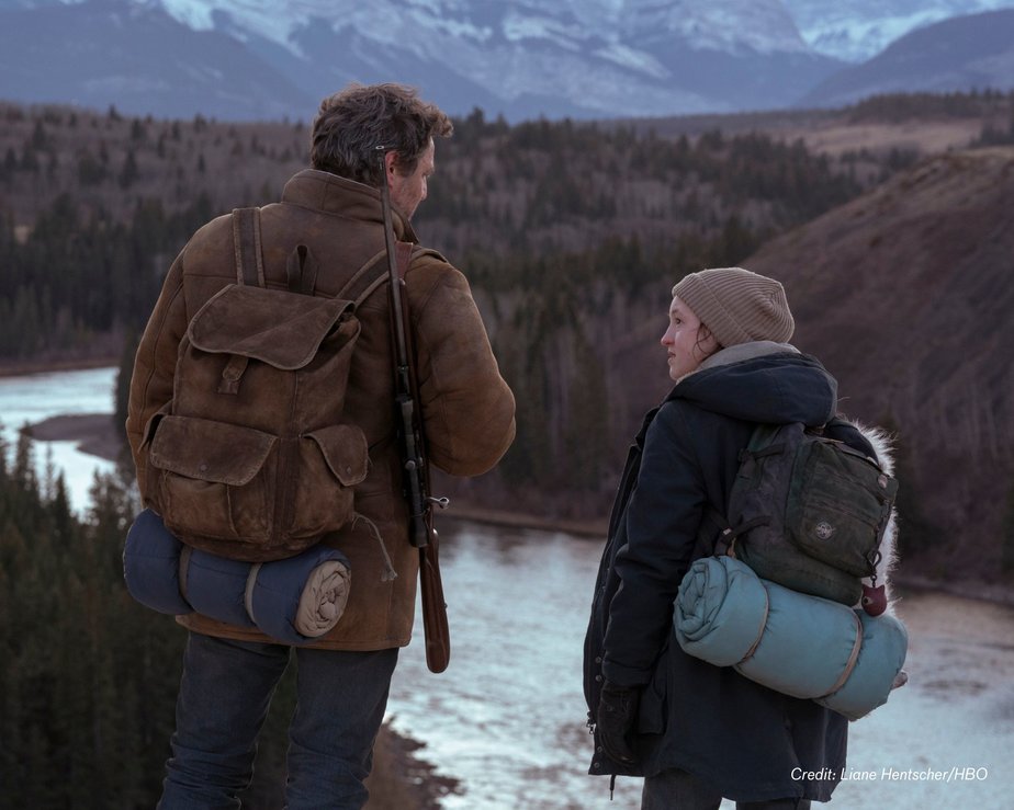 Lead male and female actors from TV series The Last Of Us look out onto Canadian wilderness