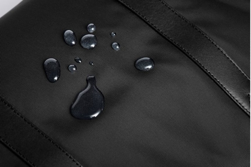 Water droplets form on the surface of a black nylon bag showing water resistance