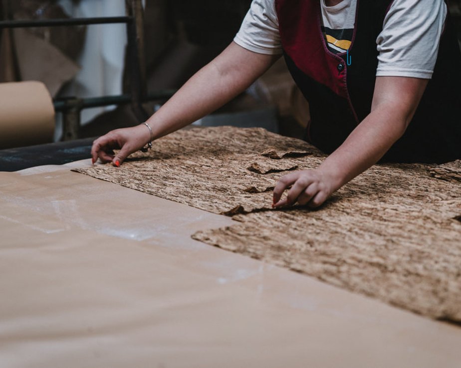 Worker treating cork leather