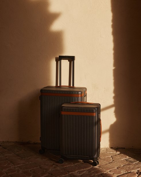Carl Friedrik luggage set half concealed by shadow