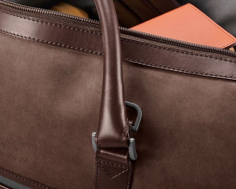 Zoomed in image of brown nubuck leather bag showing soft texture