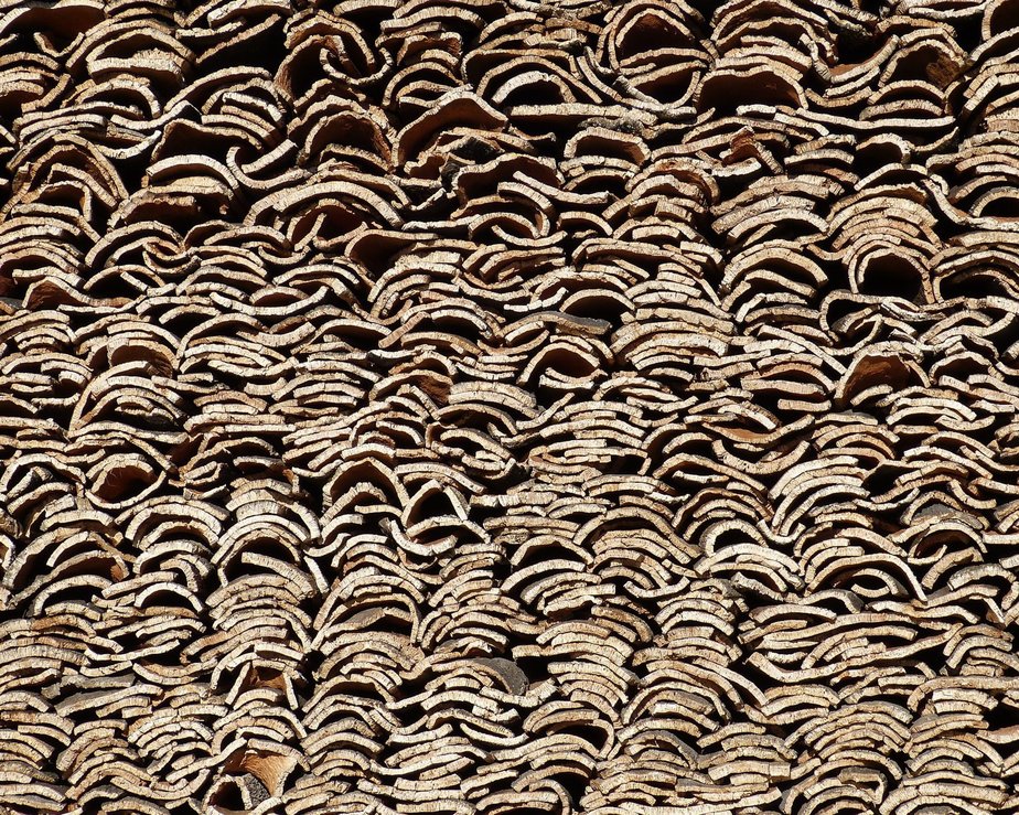 Harvested cork oak bark piled up