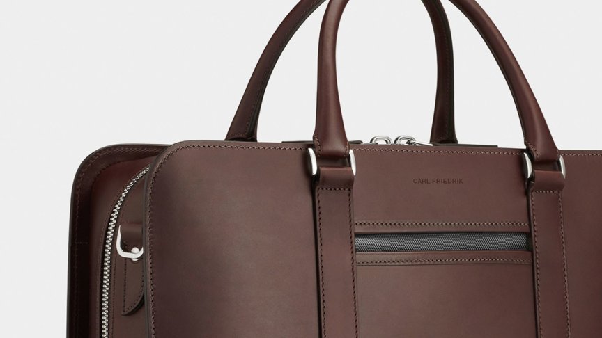 Cropped image of a premium brown leather briefcase