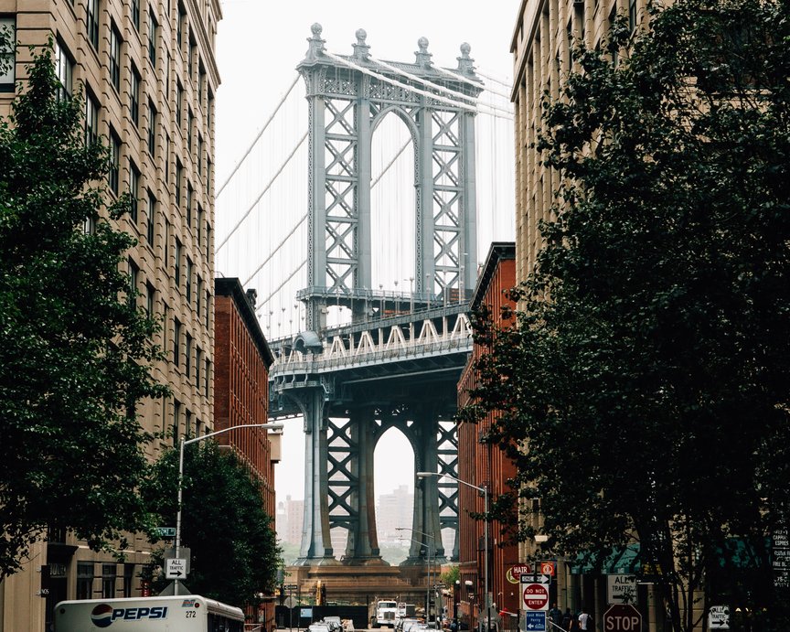 Prominent bridge nestled between two apartment blocks in American city