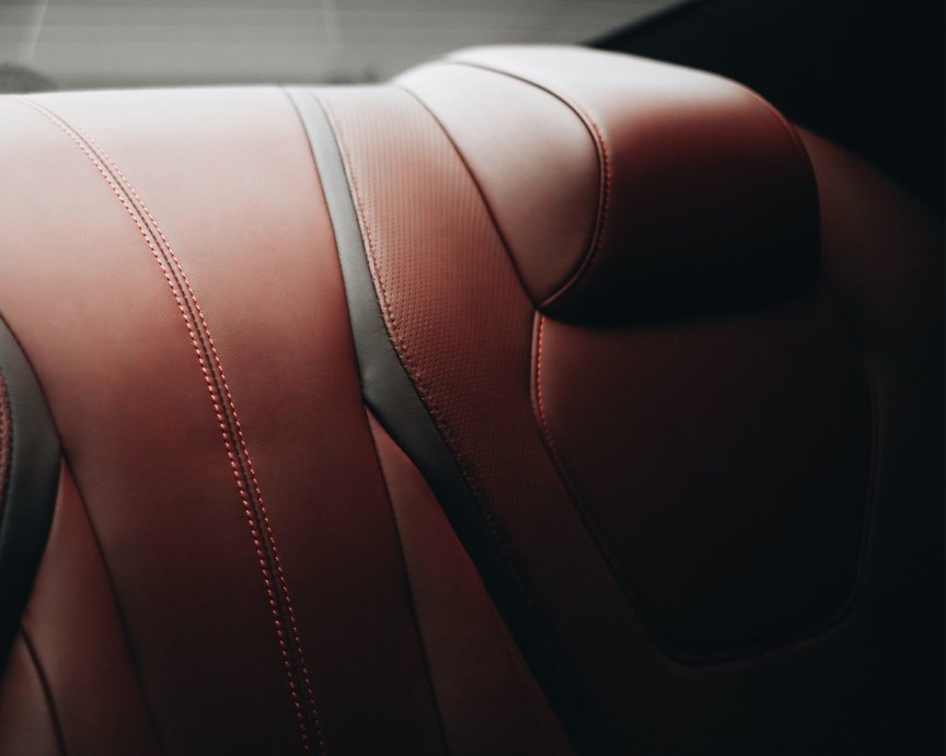 Elegant bonded leather seats inside sports car.
