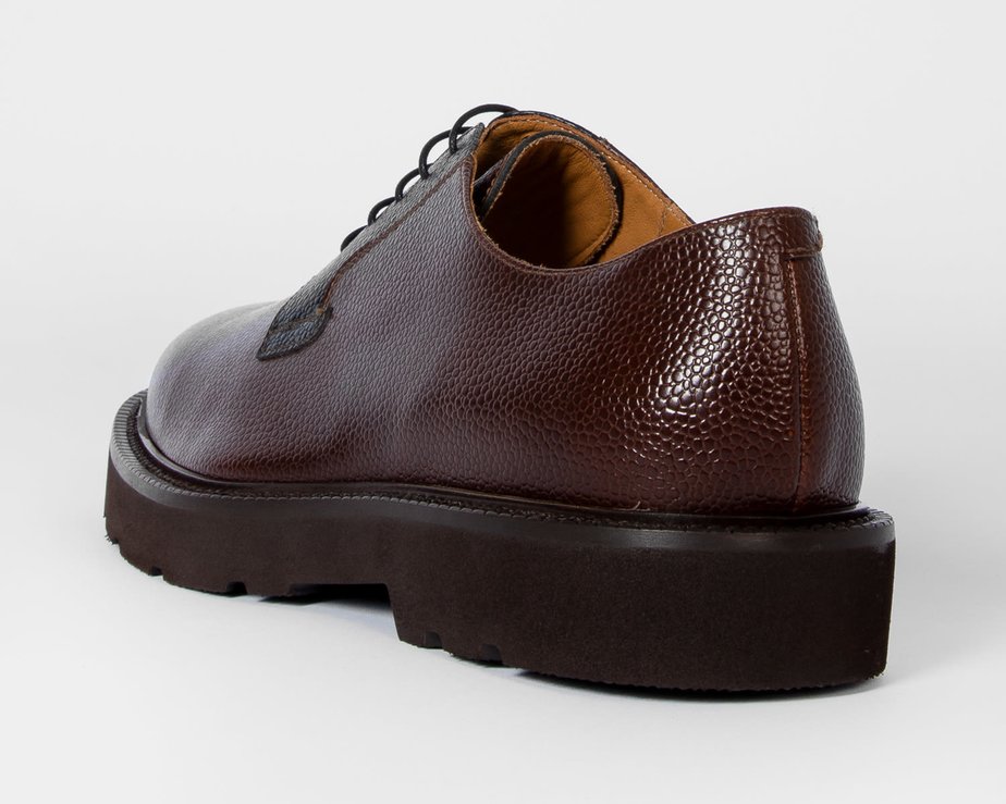 Brown pebbled leather shoe with thick black sole