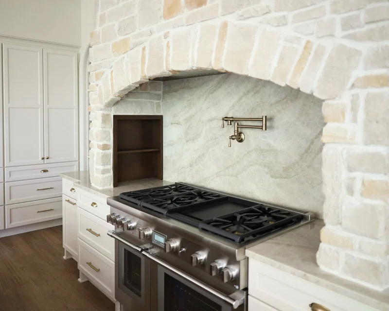 Custom kitchen with professional range and stone range surround