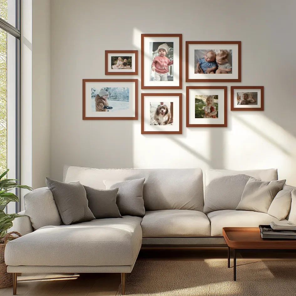 Gallery salon wall with mixed framed pictures