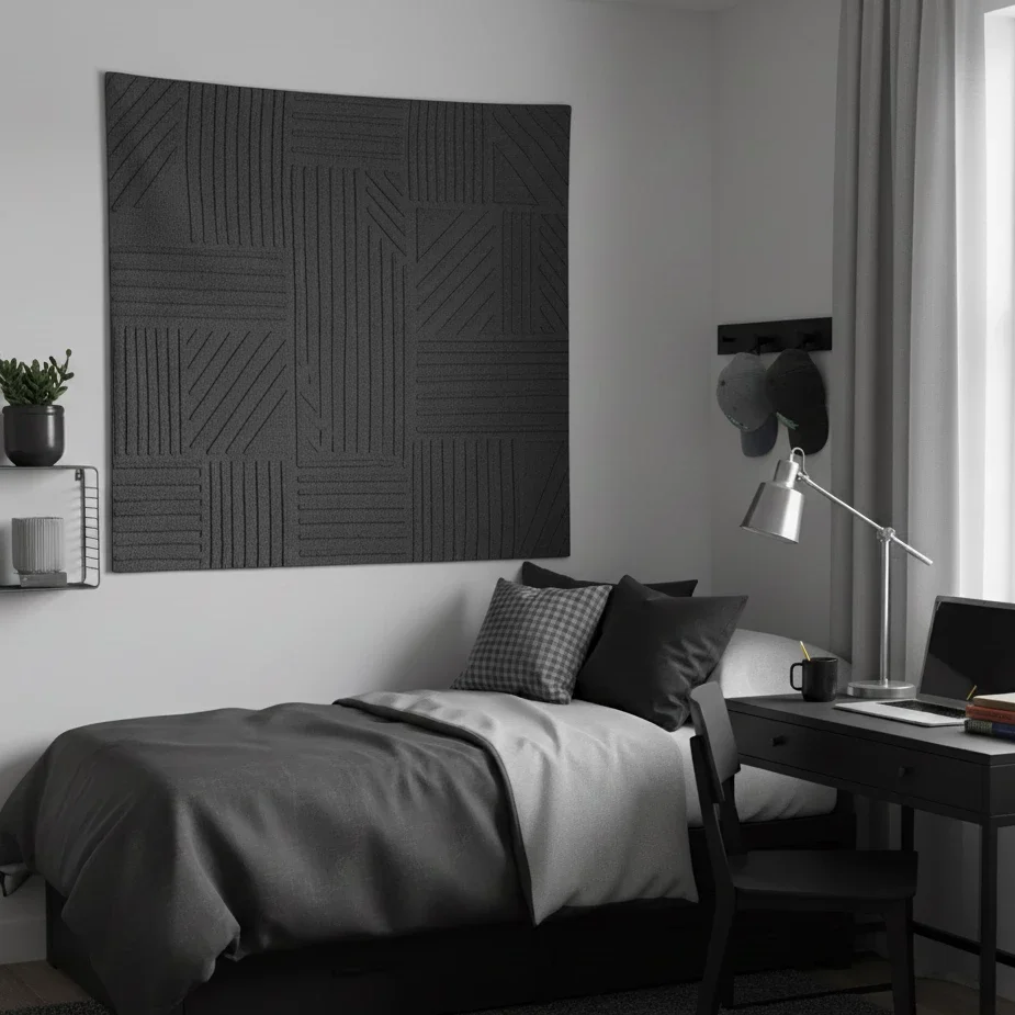 Monochrome bedroom with textured wall panel and sleek workspace