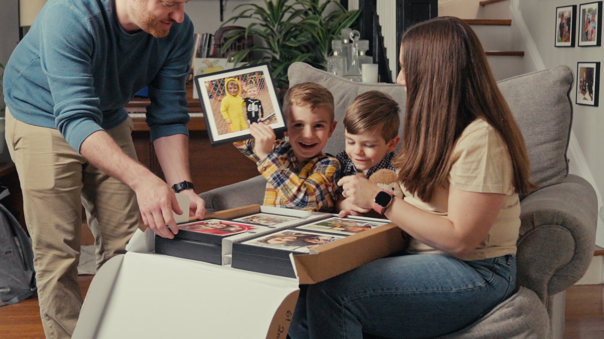 Updating their Mixtiles collection with new photos, adding fresh memories to their personalized wall art.