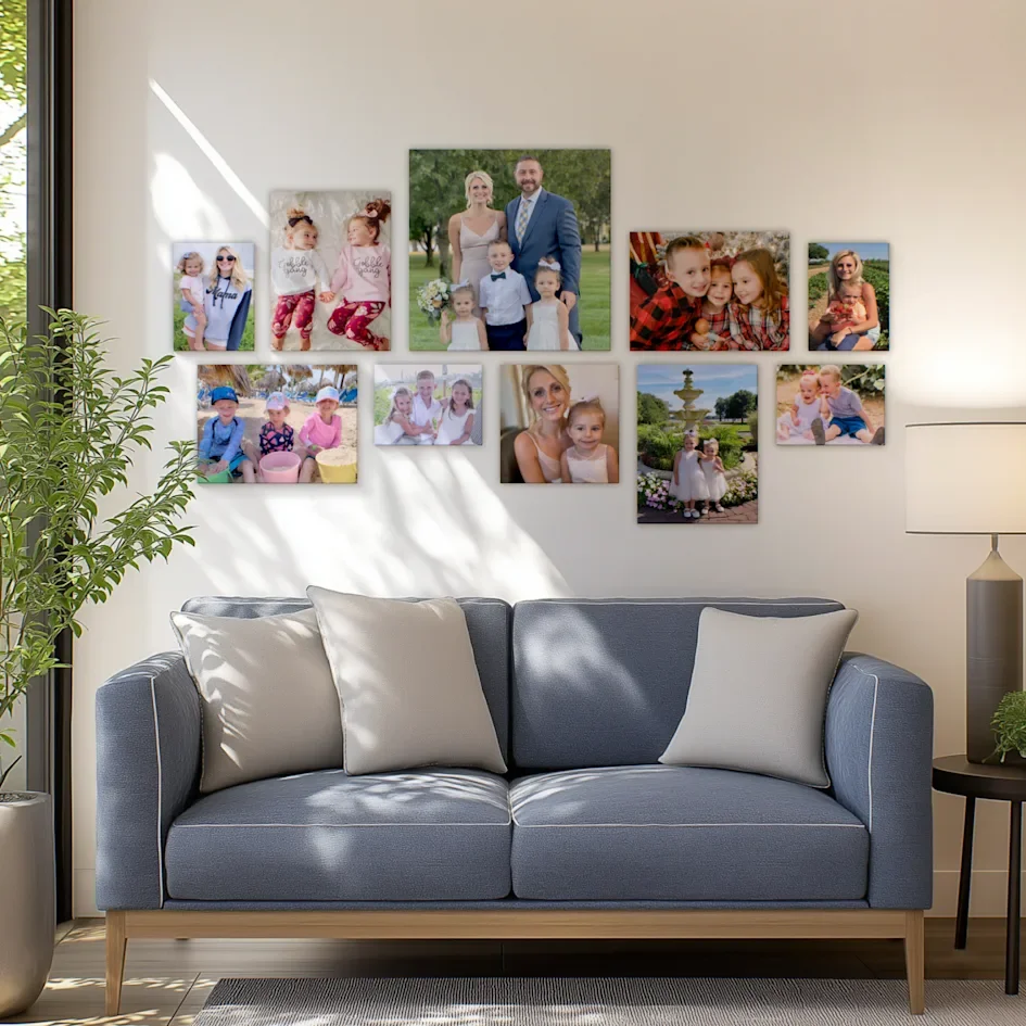 Family photo collage wall above a gray sofa