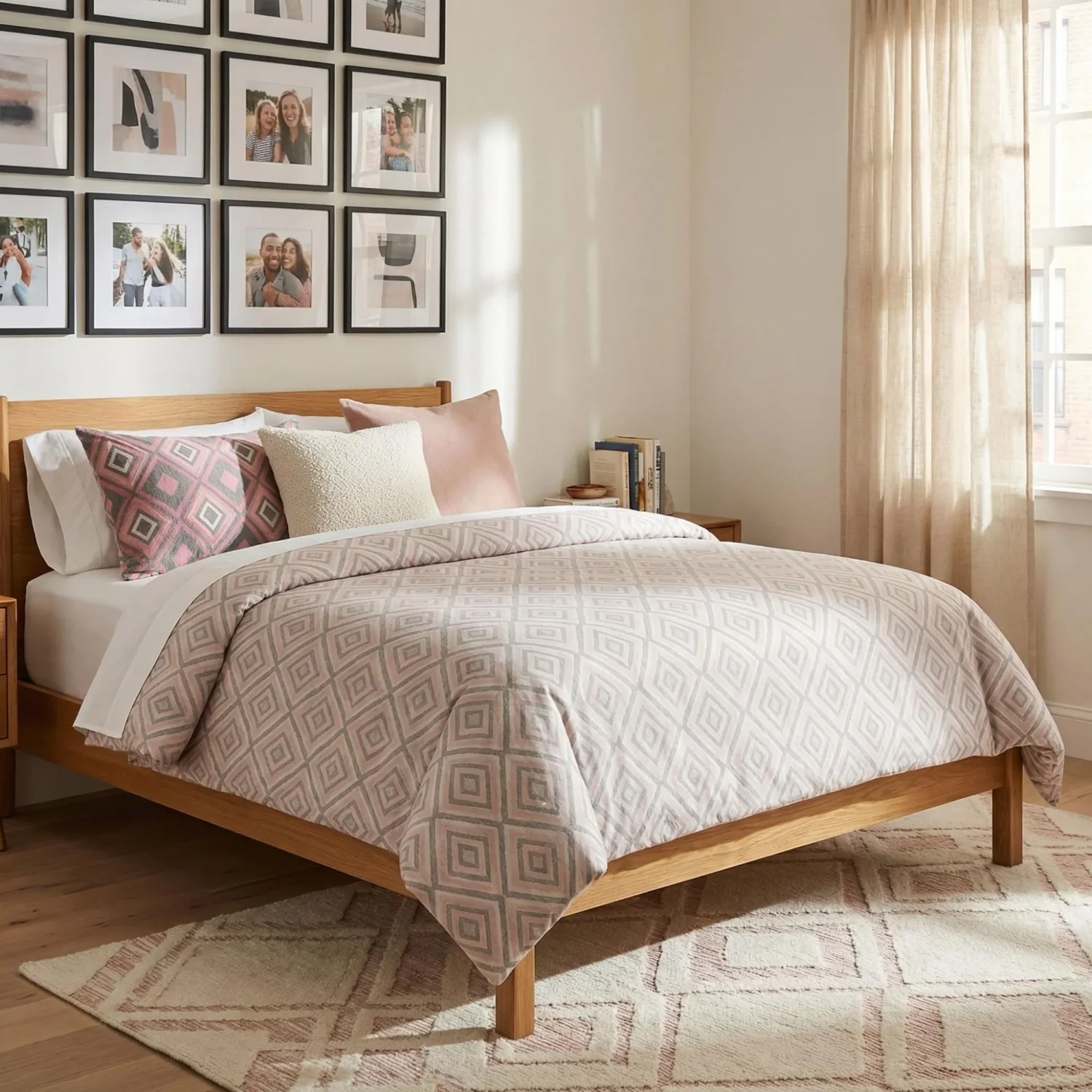 Geometric bedding and grid gallery wall in bedroom
