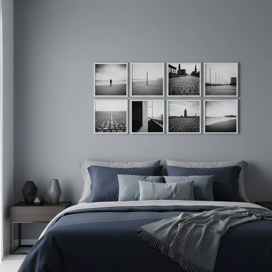 2x4 grid of monochrome prints over blue bedding