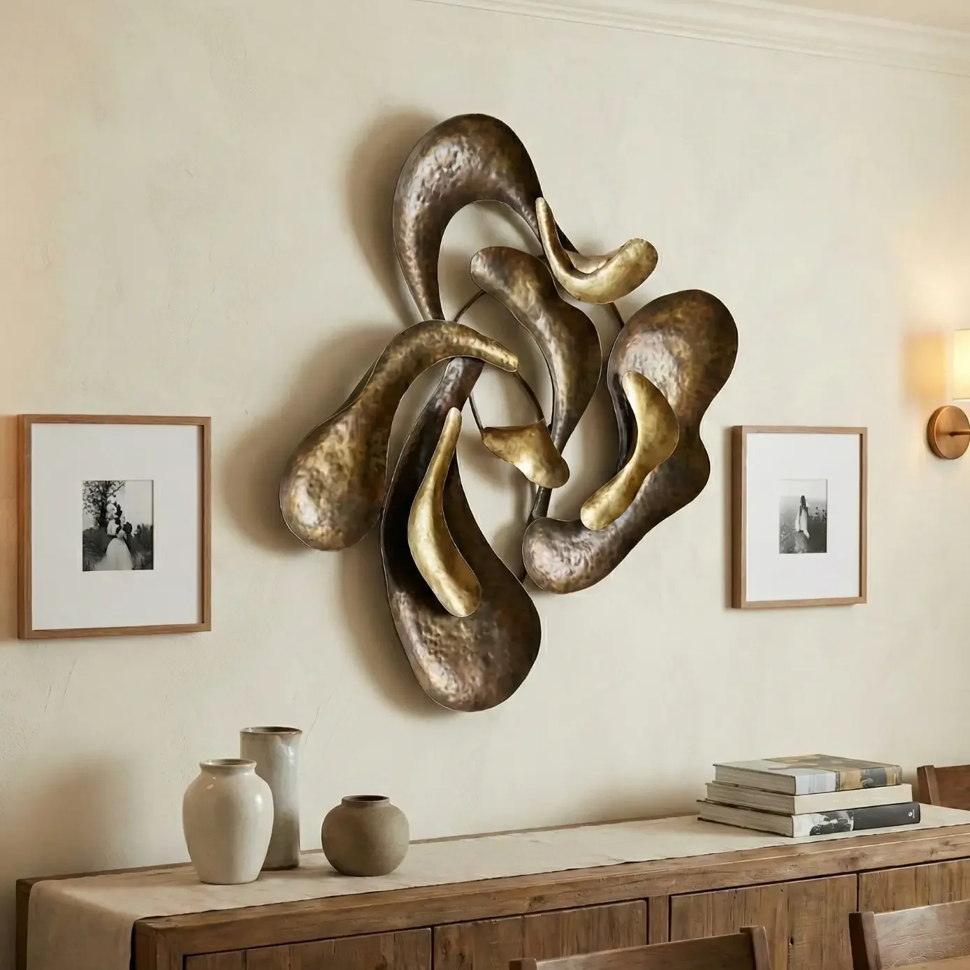 Abstract metal wall sculpture above rustic dining sideboard.