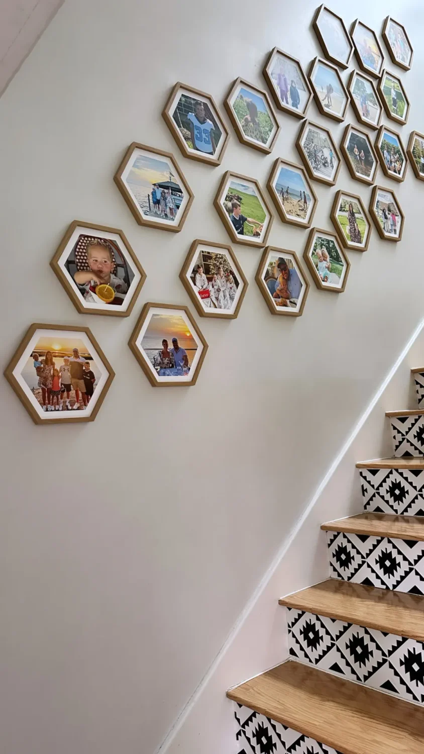 Staircase wall with hexagonal Mixtiles frames posed diagonally