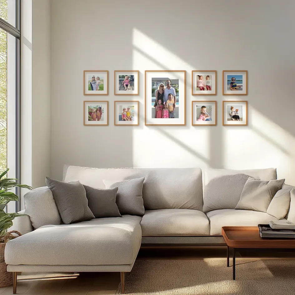 Light-filled living room with family photo collage above sofa