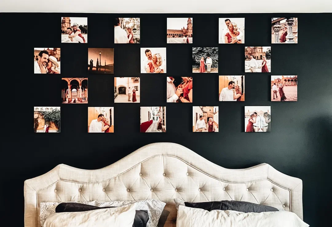 Dark green wall with carefully positioned phototiles over bed.