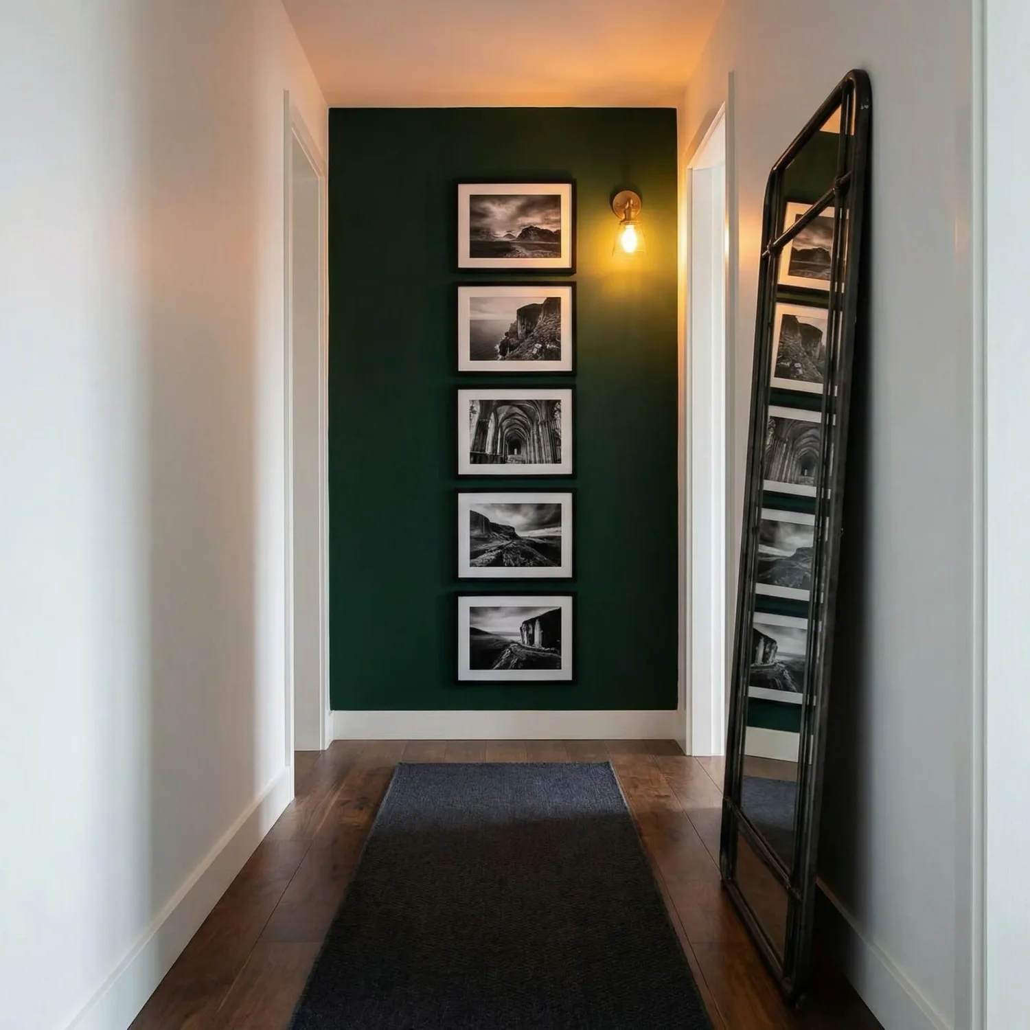 Moody dark green hallway with travel framed photos