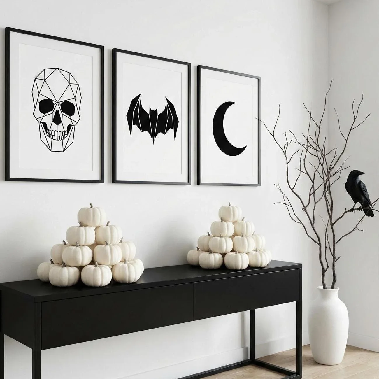 Minimal Halloween display with white pumpkins and black wall art