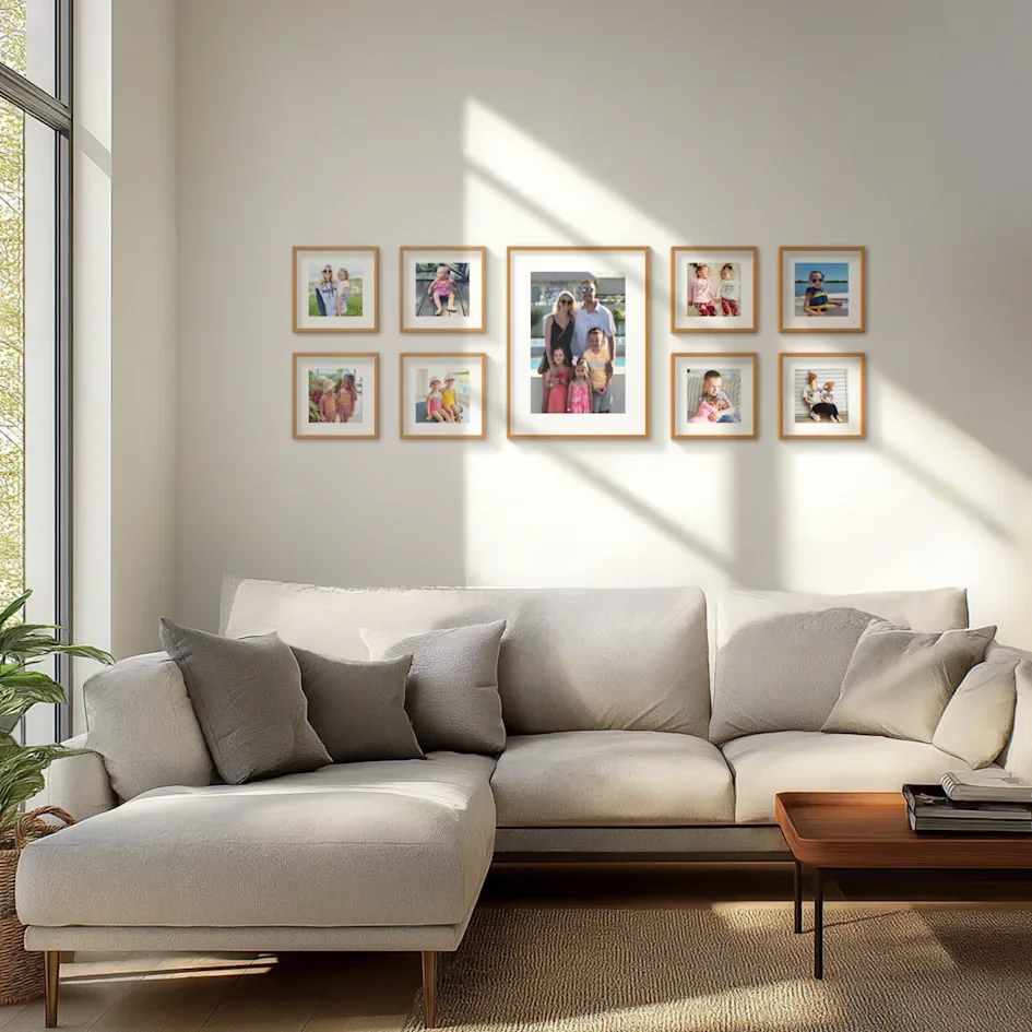 Living room wall with framed family photos in layout