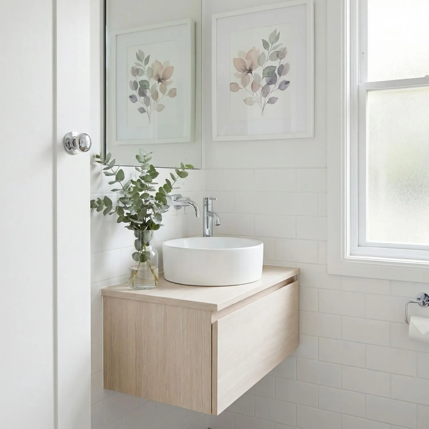 Watercolor botanical art in a white powder room