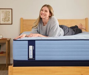 Woman on Sealy Posturepedic mattress