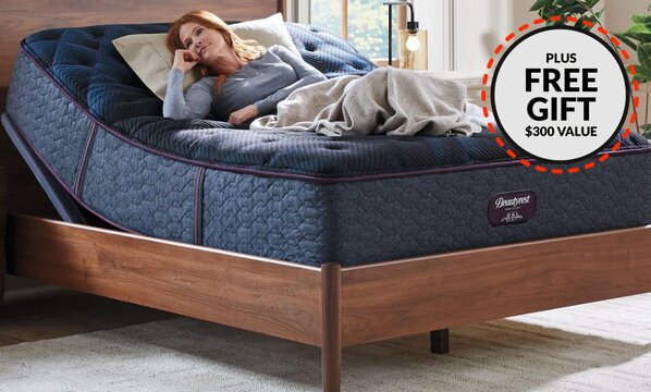 Woman on Beautyrest adjustable bed