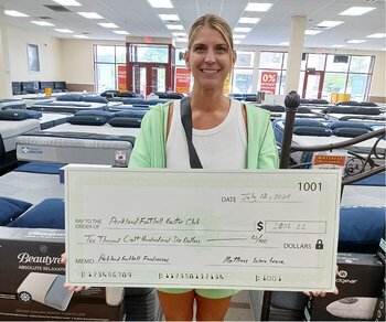 woman with fundraising check