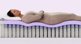 Woman laying on mattress