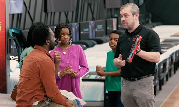 salesperson with guests in store