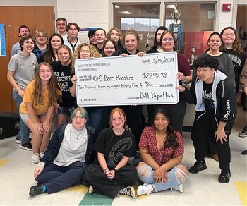 group with a fundraising check