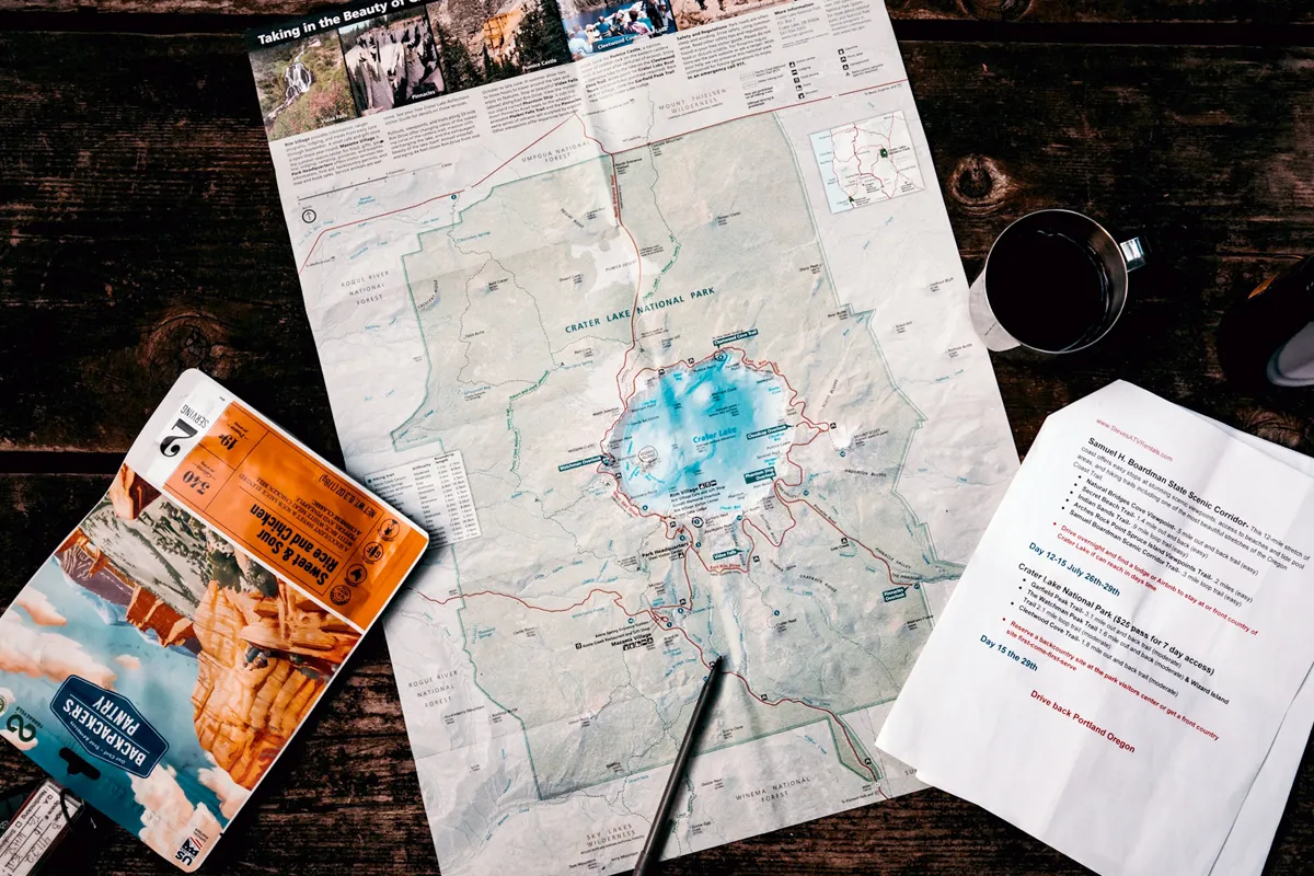 map on table with printed schedule and pen