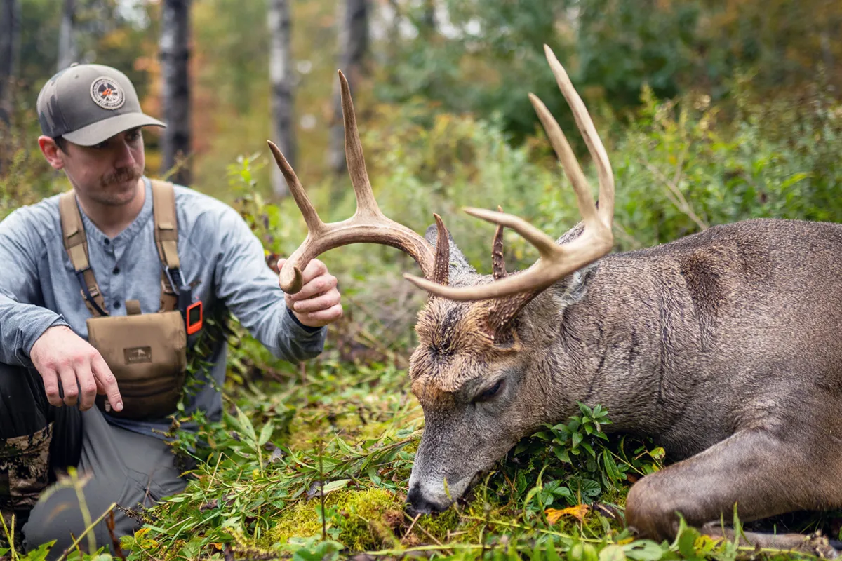 hunter with nice whitetail buck