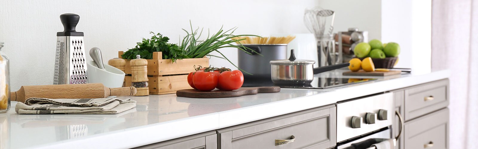 A kitchen countertop with home goods.