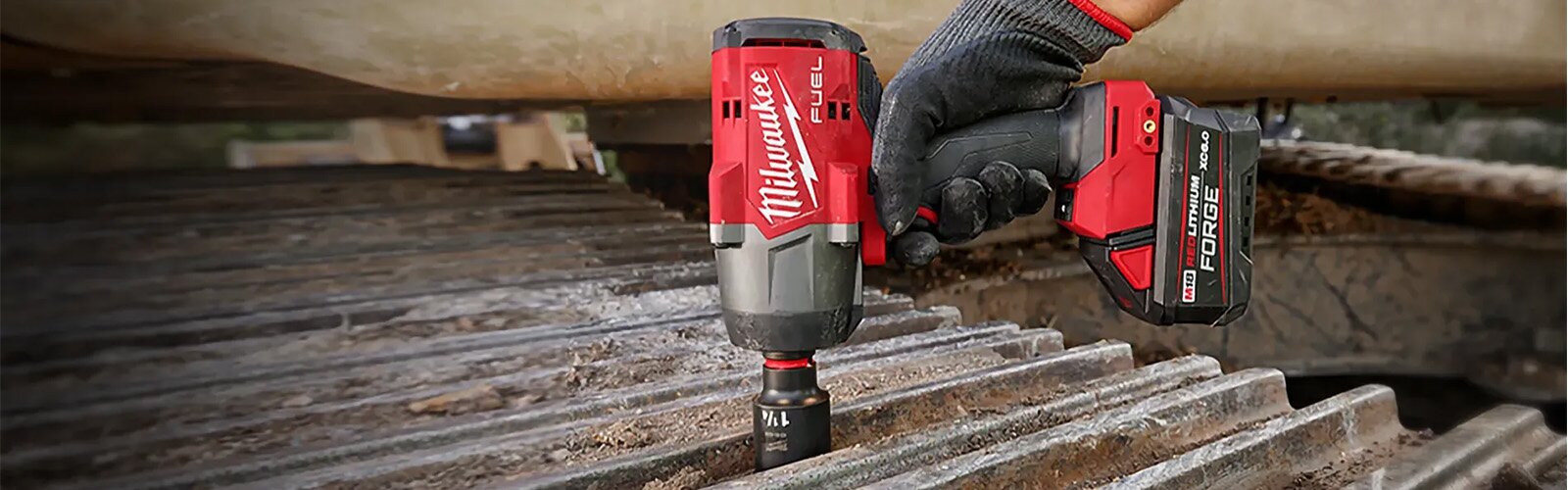 Worker using Milwaukee power screwdriver