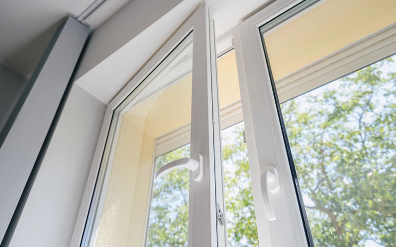 A white casement window opened for fresh air.