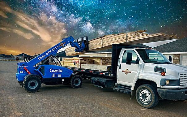 Lumber is being loaded onto a delivery truck at Johnson Lumber.